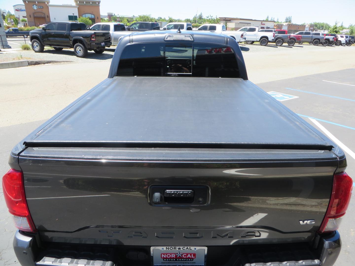 2017 CHARCOAL /GREY Toyota Tacoma TRD OFF-ROAD Double Cab Long Bed V6 6AT 4WD (3TMDZ5BN3HM) with an 3.5L V6 engine, automatic transmission, located at 2630 Grass Valley Highway, Auburn, CA, 95603, (530) 508-5100, 38.937893, -121.095482 - TRD Off-road Tacoma with a level kit, 17" Fuel Vector wheels, Falken Wildpeak AT tires, N-Fab running boards, Roll Up tonneau cover, BedRug, and window Deflectors. - Photo#11